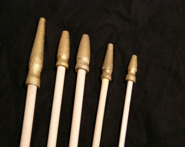 Wooden flag sticks with attached gilt spear tips, available in multiple diameters for bulk orders.